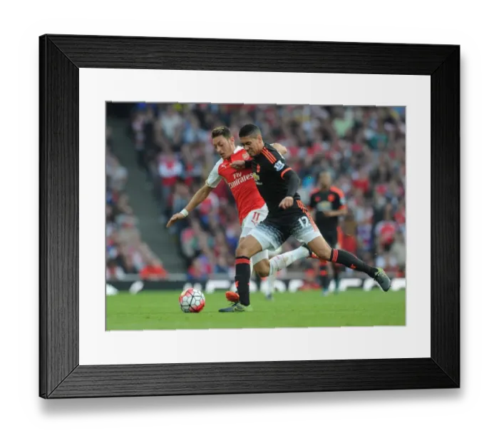 Framed Print : Mesut Ozil Closes Down Chris Smalling in Intense Arsenal vs Manchester United Clash