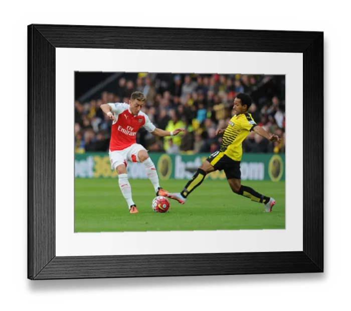 Framed Print : Mesut Ozil vs Ikechi Anya: A Premier League Battle at Vicarage Road, 2015