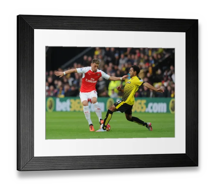 Framed Print : Mesut Ozil vs Ikechi Anya: A Premier League Showdown at Vicarage Road, 2015