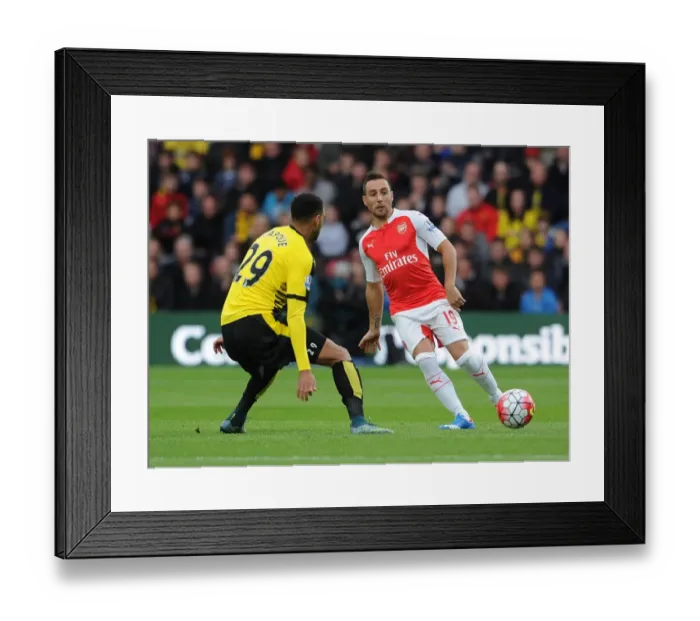 Framed Print : Clash of Midfield Titans: Cazorla vs Capoue in Premier League Battle