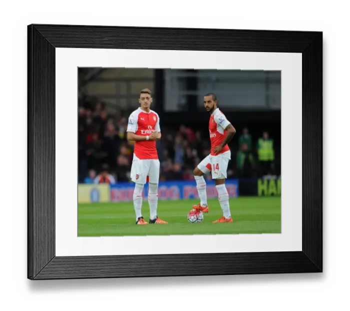 Framed Print : Arsenal's Ozil and Walcott Kick Off Premier League Clash Against Watford Framed Print : Arsenal's Ozil and Walcott Kick Off Premier League Clash Against Watford