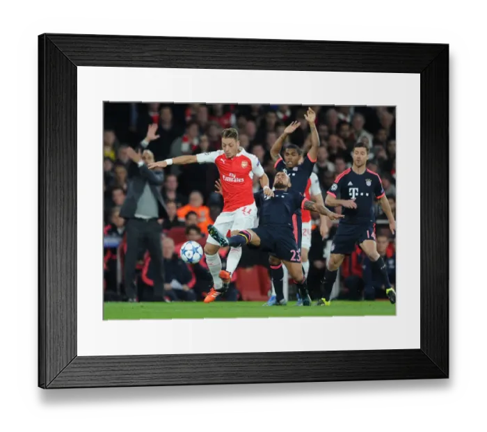 Framed Print : Ozil vs. Vidal: A Champions League Showdown - Arsenal vs. Bayern Munich