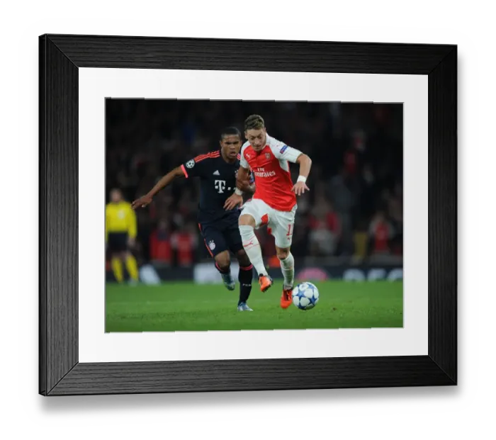 Framed Print : Mesut Ozil Outsmarts Douglas Costa: Arsenal vs Bayern Munich Champions League Showdown (2015 / 16) Framed Print : Mesut Ozil Outsmarts Douglas Costa: Arsenal vs Bayern Munich Champions League Showdown (2015 / 16)