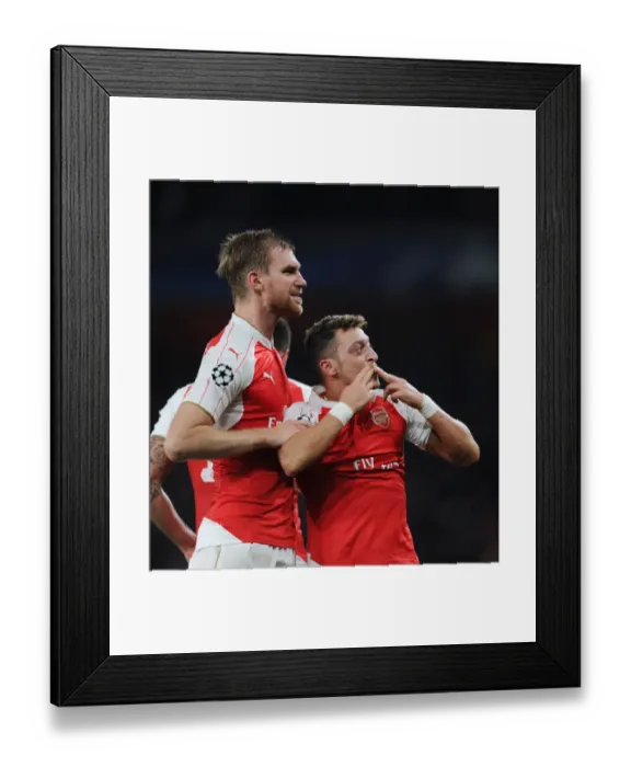 Framed Print : Arsenal's Ozil and Mertesacker Celebrate Goals Against Bayern Munich in 2015 Champions League Match Framed Print : Arsenal's Ozil and Mertesacker Celebrate Goals Against Bayern Munich in 2015 Champions League Match