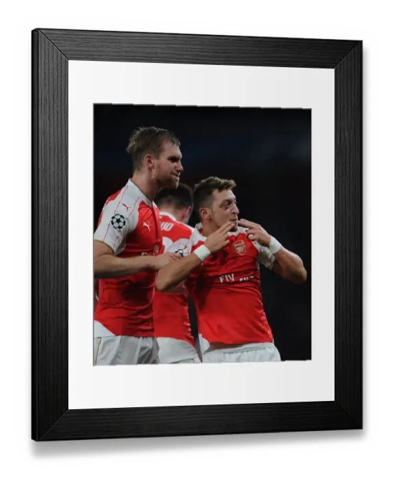 Framed Print : Mesut Ozil and Per Mertesacker: Arsenal's Unforgettable Goal Celebration vs Bayern Munich, 2015 / 16 UEFA Champions League