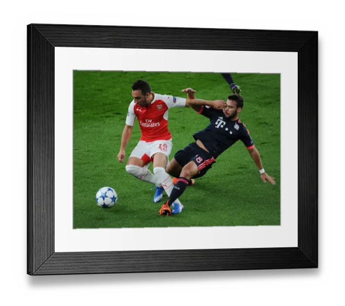 Framed Print : Clash of Titans: Santi Cazorla vs. Juan Bernat - Arsenal vs. Bayern Munich, UEFA Champions League
