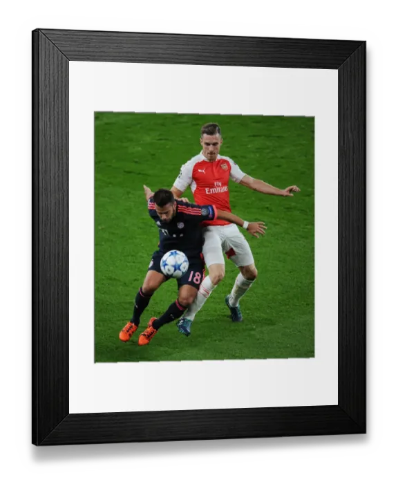 Framed Print : Arsenal vs. Bayern Munich: A Champions League Battle at Emirates Stadium