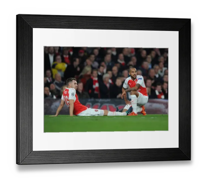 Framed Print : Arsenal FC: Theo Walcott Comforts Injured Aaron Ramsey during the Arsenal vs. FC Bayern Munich UCL Clash (2015 / 16) Framed Print : Arsenal FC: Theo Walcott Comforts Injured Aaron Ramsey during the Arsenal vs. FC Bayern Munich UCL Clash (2015 / 16)