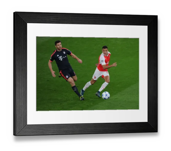 Framed Print : Alexis Sanchez Outsmarts Xabi Alonso: Arsenal vs Bayern Munich Champions League Showdown Framed Print : Alexis Sanchez Outsmarts Xabi Alonso: Arsenal vs Bayern Munich Champions League Showdown
