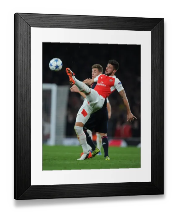 Framed Print : Giroud vs. Kimmich: Intense Battle in Arsenal FC vs. FC Bayern Munich UEFA Champions League Clash