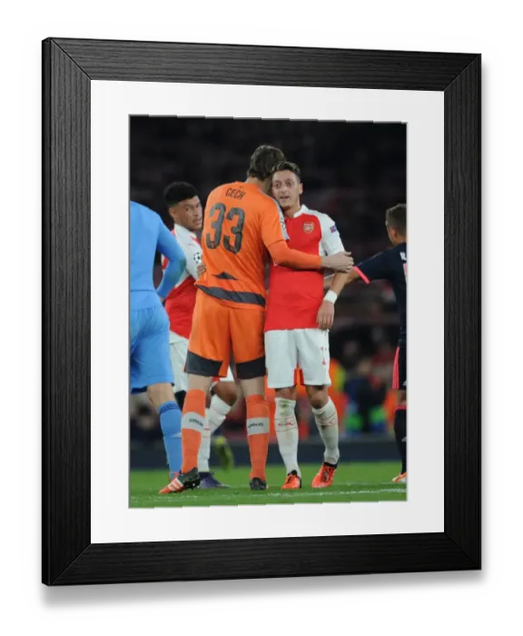 Framed Print : Mesut Ozil's Dramatic Late Goal: Arsenal Stuns Bayern Munich in Champions League Showdown
