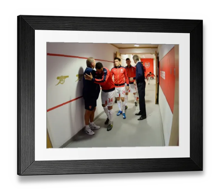 Framed Print : Arsenal: A Team United - Coquelin and Kit Man Vic Akers Heartwarming Embrace Before Arsenal v Everton (2015 / 16) Framed Print : Arsenal: A Team United - Coquelin and Kit Man Vic Akers Heartwarming Embrace Before Arsenal v Everton (2015 / 16)