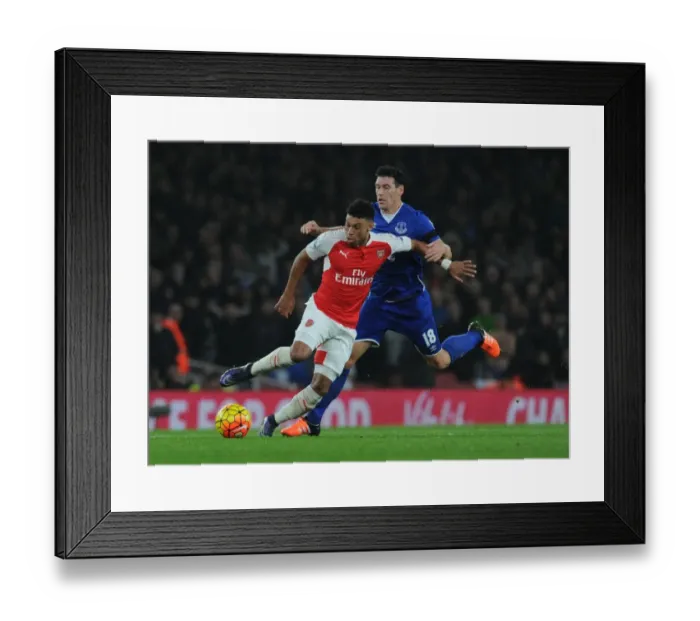 Framed Print : Oxlade-Chamberlain vs. Barry: A Premier League Battle at Emirates Stadium
