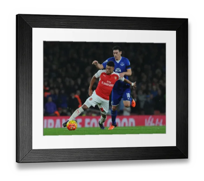 Framed Print : Oxlade-Chamberlain vs. Barry: A Premier League Showdown at Emirates Stadium