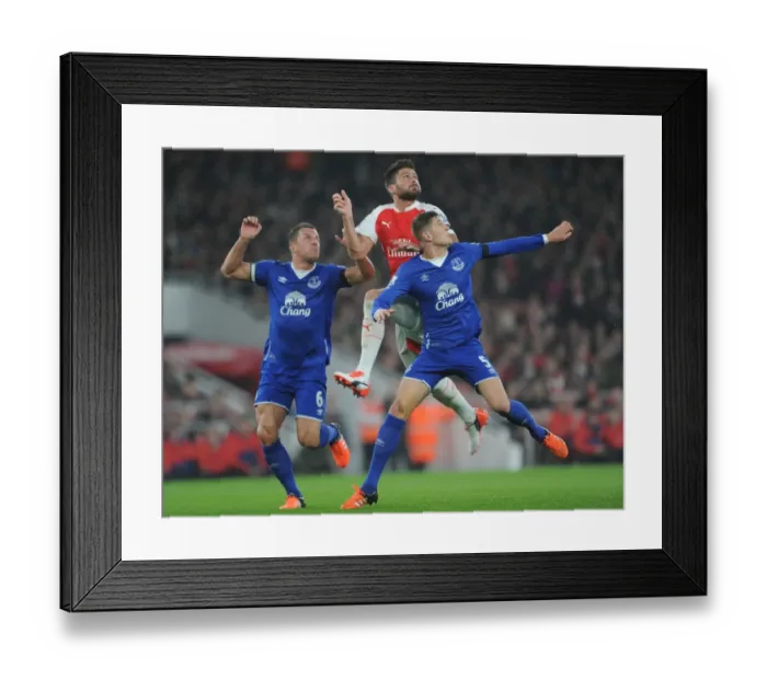 Framed Print : Giroud vs Jagielka & Stones: Intense Face-Off Between Arsenal's Star Striker and Everton's Defenders Framed Print : Giroud vs Jagielka & Stones: Intense Face-Off Between Arsenal's Star Striker and Everton's Defenders