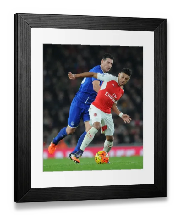 Framed Print : Clash of Midfield Titans: Oxlade-Chamberlain vs. Barry in Arsenal vs. Everton Showdown Framed Print : Clash of Midfield Titans: Oxlade-Chamberlain vs. Barry in Arsenal vs. Everton Showdown