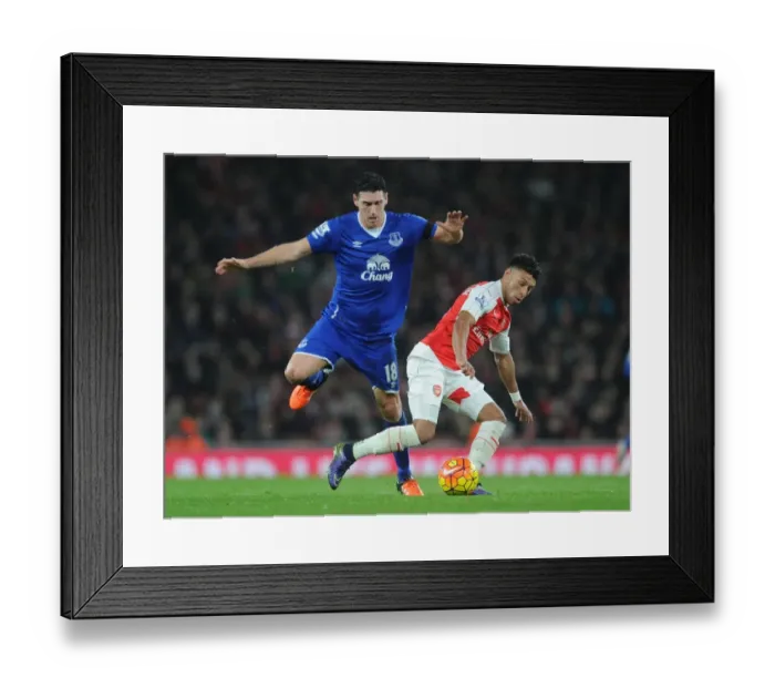 Framed Print : Clash of the Midfielders: Oxlade-Chamberlain vs. Barry in Intense Arsenal vs. Everton Battle Framed Print : Clash of the Midfielders: Oxlade-Chamberlain vs. Barry in Intense Arsenal vs. Everton Battle