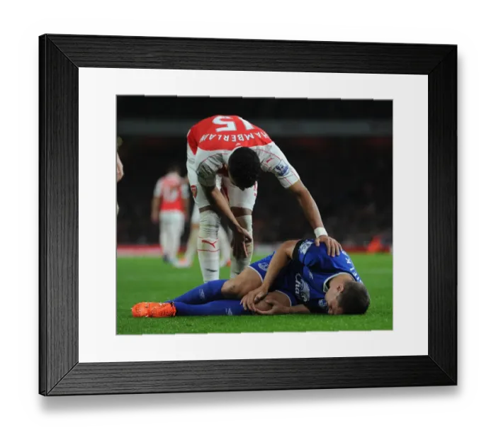 Framed Print : Compassion on the Field: Oxlade-Chamberlain Consoles Injured Jagielka (Arsenal vs. Everton, 2015 / 16) Framed Print : Compassion on the Field: Oxlade-Chamberlain Consoles Injured Jagielka (Arsenal vs. Everton, 2015 / 16)