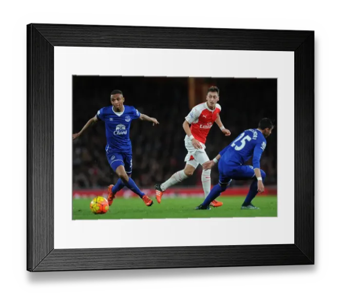 Framed Print : Mesut Ozil vs Everton's Defense: A Battle of Wits in the Arsenal vs Everton Premier League Clash, 2015 / 16 Framed Print : Mesut Ozil vs Everton's Defense: A Battle of Wits in the Arsenal vs Everton Premier League Clash, 2015 / 16