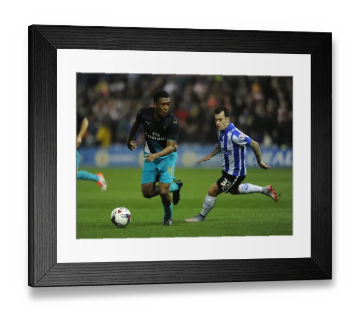 Framed Print : Arsenal's Alex Iwobi Goes Head-to-Head with Ross Wallace in Capital One Cup Showdown Framed Print : Arsenal's Alex Iwobi Goes Head-to-Head with Ross Wallace in Capital One Cup Showdown