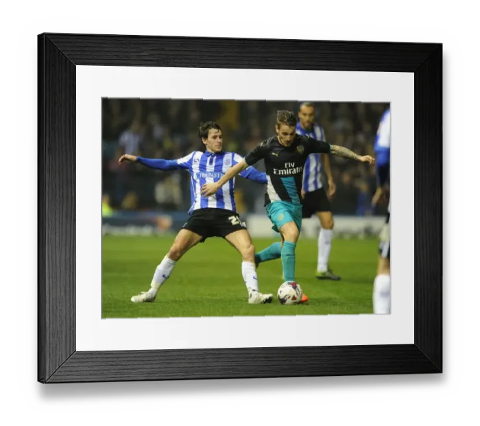 Framed Print : Debuchy vs. Lee: Arsenal's Defender Clashes With Sheffield Wednesday's Midfielder in Capital One Cup Showdown