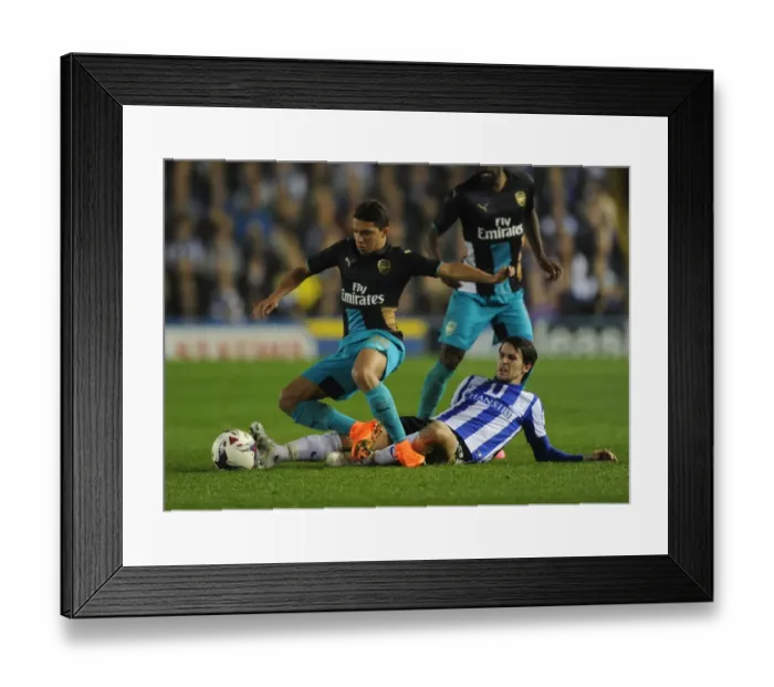 Framed Print : Bennacer vs. Hutchinson: A Battle in the Capital One Cup Clash Between Arsenal and Sheffield Wednesday Framed Print : Bennacer vs. Hutchinson: A Battle in the Capital One Cup Clash Between Arsenal and Sheffield Wednesday