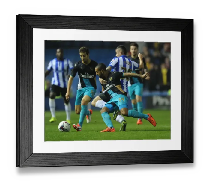 Framed Print : Theo Walcott vs Daniel Pudil: A Fight for Supremacy in the Capital One Cup