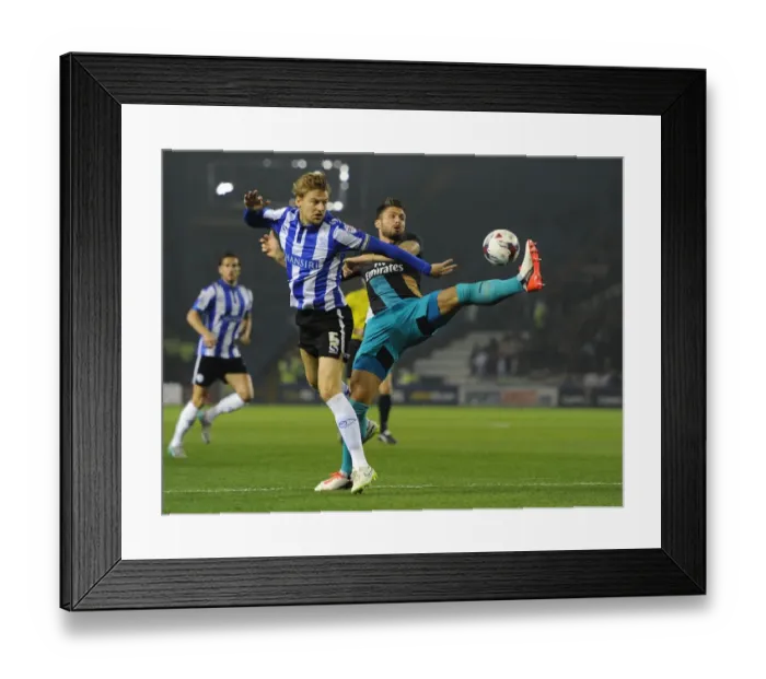 Framed Print : Giroud vs Loovens: A Battle in the Capital One Cup - Sheffield Wednesday vs Arsenal
