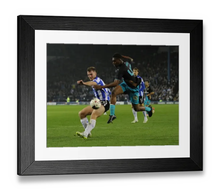 Framed Print : Arsenal's Alex Iwobi vs. Sheffield Wednesday's Tom Lees: A Capital One Cup Showdown Framed Print : Arsenal's Alex Iwobi vs. Sheffield Wednesday's Tom Lees: A Capital One Cup Showdown