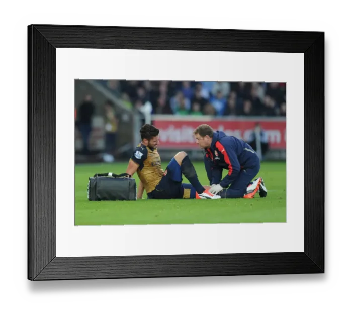 Framed Print : Arsenal's Olivier Giroud Receives Medical Attention from Physio Colin Lewin during Swansea Match, 2015-16 Framed Print : Arsenal's Olivier Giroud Receives Medical Attention from Physio Colin Lewin during Swansea Match, 2015-16
