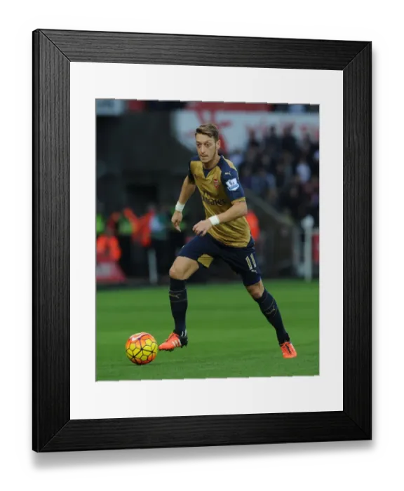 Framed Print : Mesut Ozil: In Action Against Swansea City, Premier League 2015-16 Framed Print : Mesut Ozil: In Action Against Swansea City, Premier League 2015-16