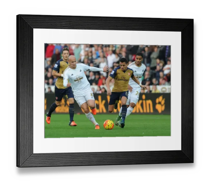 Framed Print : Alexis Sanchez Outmaneuvers Jonjo Shelvey: Arsenal's Thrilling Moment in Swansea Clash (2015-16)