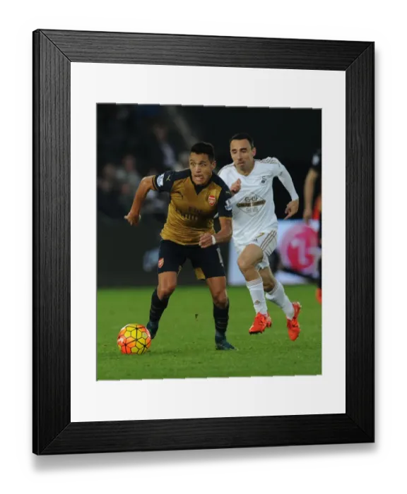 Framed Print : Alexis Sanchez Surges Past Leon Britton: Swansea City vs Arsenal, Premier League 2015-16 - A Moment of Brilliance Framed Print : Alexis Sanchez Surges Past Leon Britton: Swansea City vs Arsenal, Premier League 2015-16 - A Moment of Brilliance