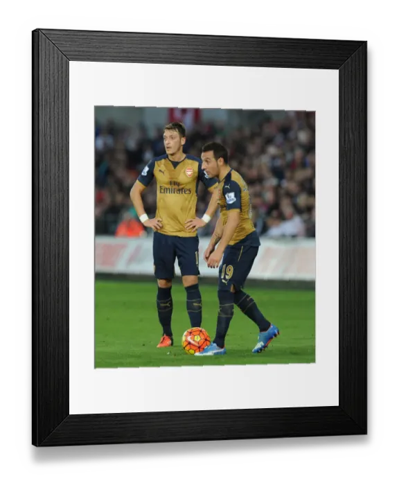 Framed Print : Arsenal's Ozil and Cazorla Lock Horns in Swansea City vs Arsenal (2015-16)