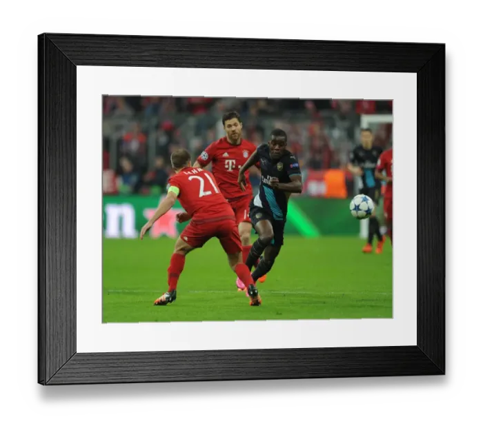 Framed Print : Battle of Champions: Campbell vs. Lahm - Arsenal vs. Bayern Munich, UEFA Champions League Framed Print : Battle of Champions: Campbell vs. Lahm - Arsenal vs. Bayern Munich, UEFA Champions League