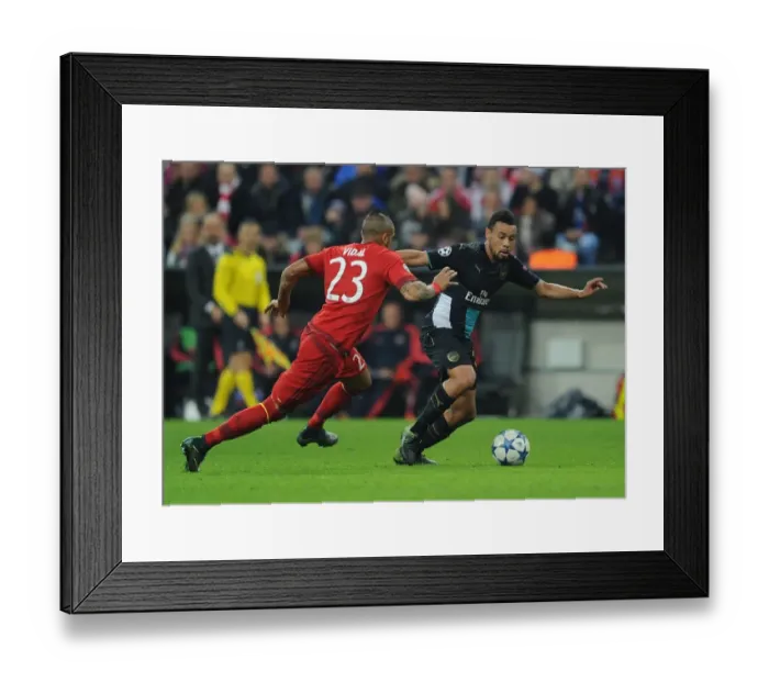 Framed Print : Clash of Titans: Sanchez vs. Vidal - Arsenal's Star Forward vs. Bayern's Midfield Maestro in the UEFA Champions League Showdown Framed Print : Clash of Titans: Sanchez vs. Vidal - Arsenal's Star Forward vs. Bayern's Midfield Maestro in the UEFA Champions League Showdown