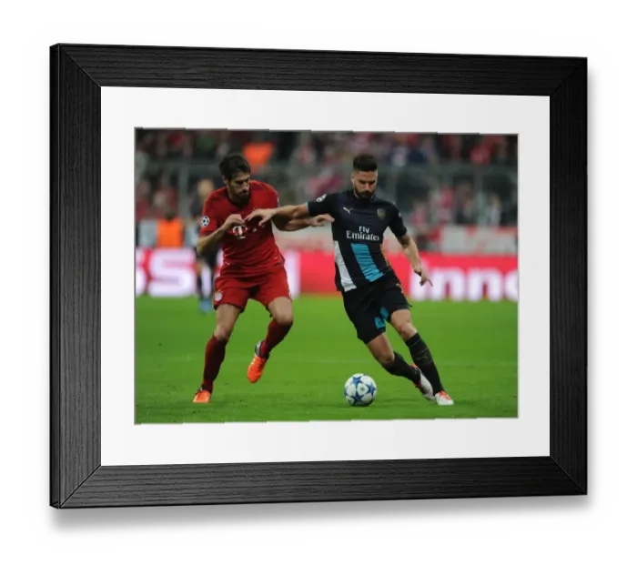Framed Print : Clash of Titans: Olivier Giroud vs. Javi Martinez - A Battle of Strength and Skill in the UEFA Champions League