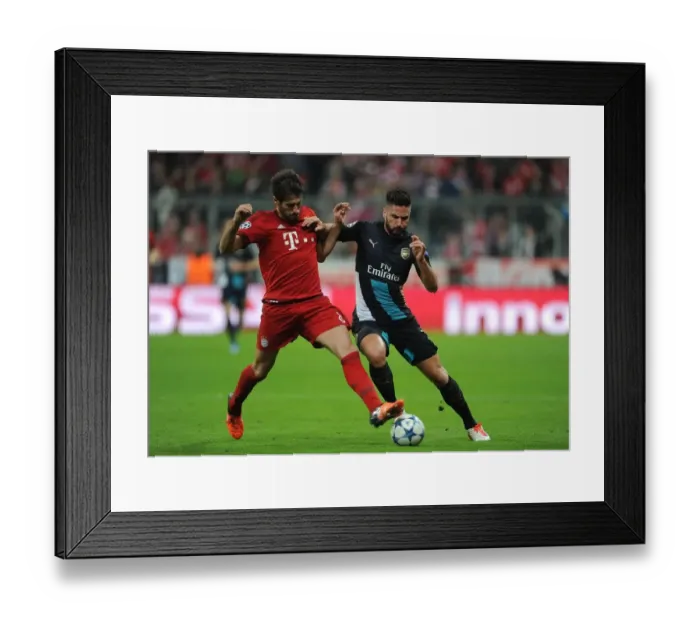 Framed Print : Clash of Titans: Olivier Giroud vs. Javi Martinez - A Battle for Supremacy in the UEFA Champions League