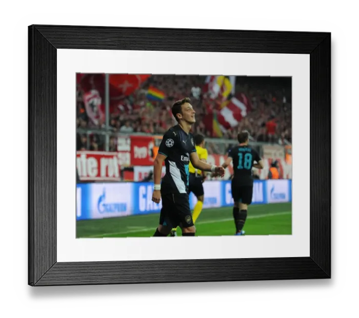 Framed Print : Clash at the Allianz Arena: Mesut Ozil Faces His Former Team - Bayern Munich vs Arsenal, UEFA Champions League