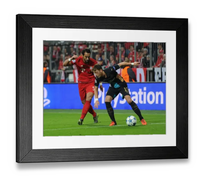 Framed Print : Mesut Ozil vs. Medhi Benatia: A Champions League Showdown Framed Print : Mesut Ozil vs. Medhi Benatia: A Champions League Showdown