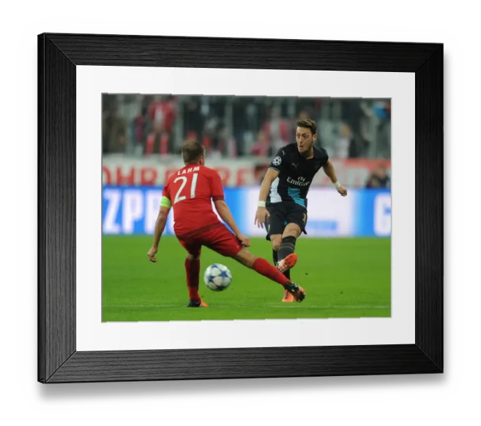 Framed Print : Mesut Ozil vs. Philipp Lahm: A Midfield Duel of Champions League Greats