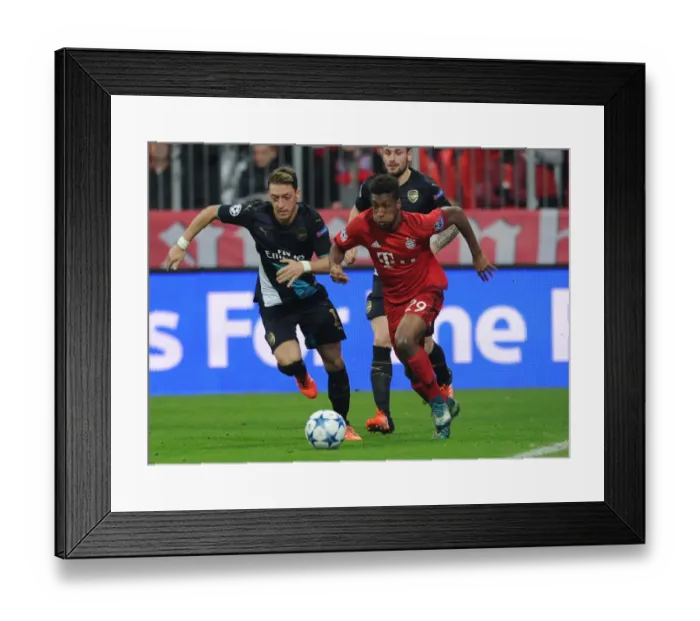 Framed Print : Mesut Ozil vs. Kingsley Coman: A Champions League Showdown