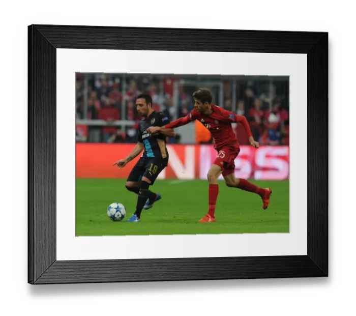 Framed Print : Clash of Titans: Santi Cazorla vs Thomas Muller - Battle at the Allianz Arena Framed Print : Clash of Titans: Santi Cazorla vs Thomas Muller - Battle at the Allianz Arena