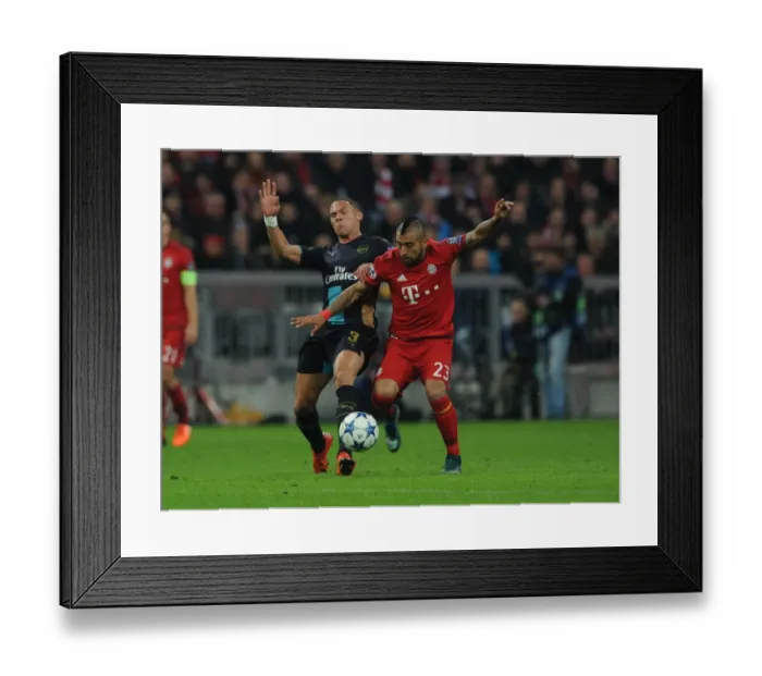 Framed Print : Clash of Titans: Kieran Gibbs vs Arturo Vidal - Battle at the Allianz Arena Framed Print : Clash of Titans: Kieran Gibbs vs Arturo Vidal - Battle at the Allianz Arena