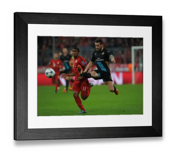 Framed Print : Champions Clash: Debuchy vs. Costa - Battle at the Allianz Arena (Bayern Munich vs. Arsenal, UEFA Champions League, 2015-16) Framed Print : Champions Clash: Debuchy vs. Costa - Battle at the Allianz Arena (Bayern Munich vs. Arsenal, UEFA Champions League, 2015-16)