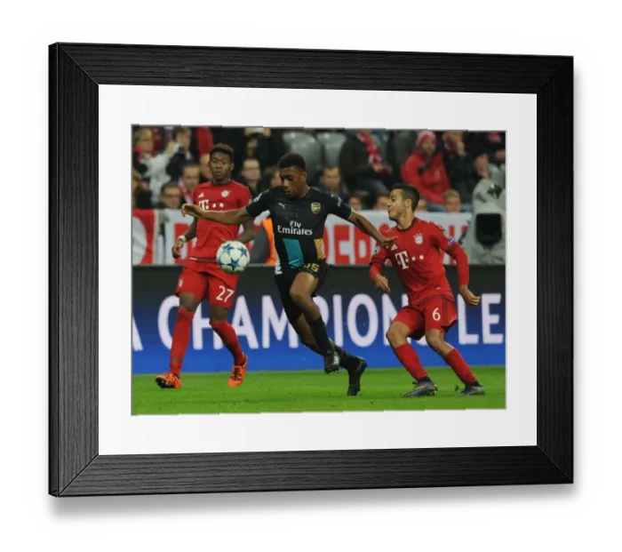 Framed Print : Arsenal's Iwobi Overpowers Thiago in Champions League Clash