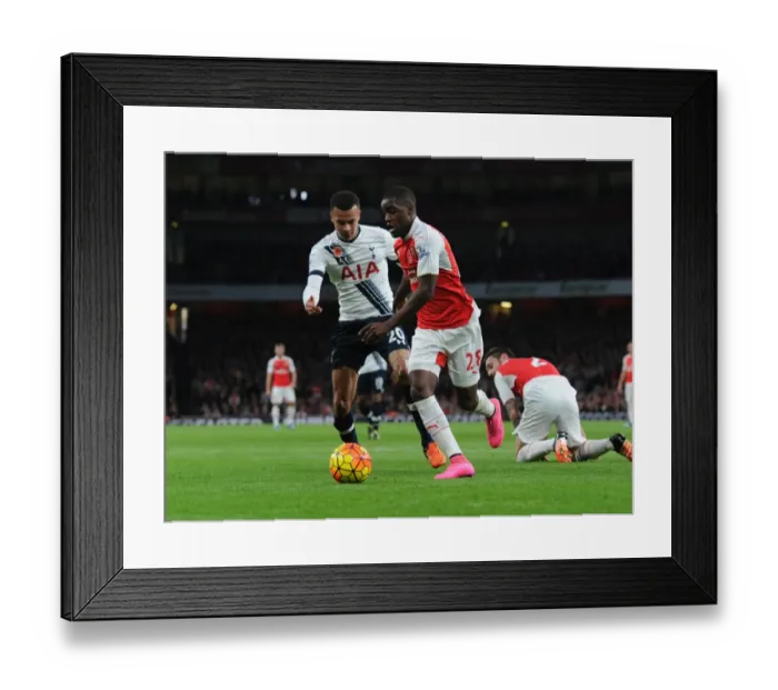 Framed Print : Arsenal vs. Tottenham: London's Intense Rivalry in the Premier League - Campbell vs. Alli Clash
