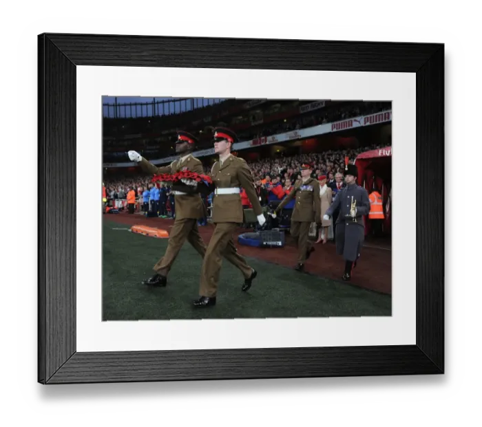 Framed Print : Remembrance Sunday at Emirates Stadium: Soldiers Honor the Fallen Before Arsenal vs. Tottenham Match, 2015
