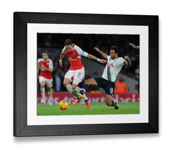 Framed Print : Ozil vs. Dembele: An Intense Battle in the 2015-16 Premier League - Arsenal vs. Tottenham Framed Print : Ozil vs. Dembele: An Intense Battle in the 2015-16 Premier League - Arsenal vs. Tottenham