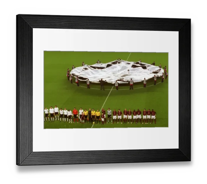 Framed Print : The Arsenal team line up before the match with the Champions League banner behind them